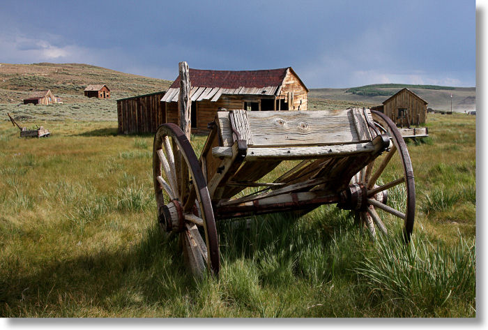 Abandoned wagon and barn in Bodie, California